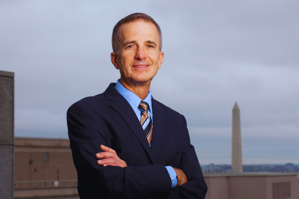 D.C. Bar CEO Bob Spagnoletti standing in front of the Washington Monument.